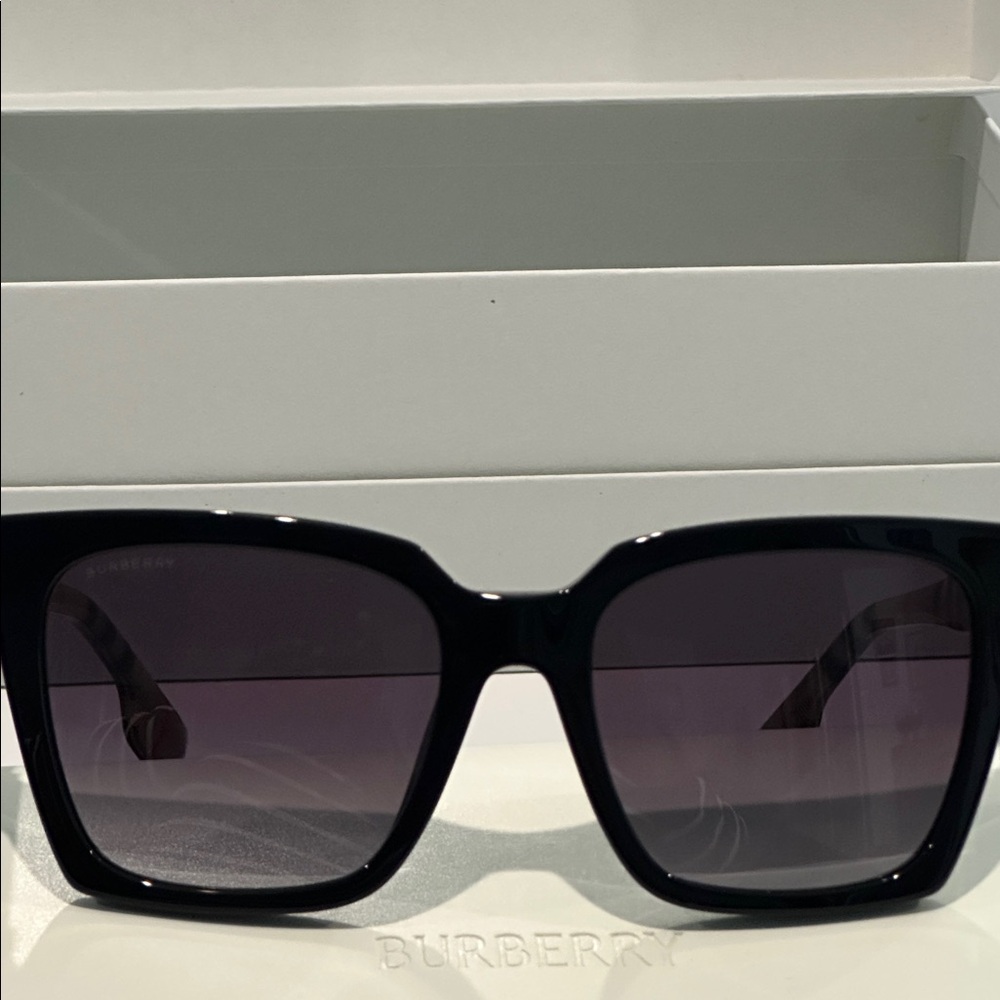 New in Box Burberry Black Lense Luxottica Frame with Nova Check handles.